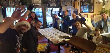 Packing up row after row of fresh, warm meals for the Tacoma community.