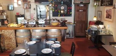 A look inside our cozy dining room, set up and ready to welcome neighbors.