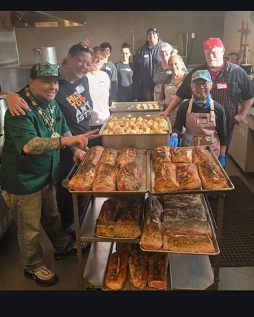 Packing up row after row of fresh, warm community meals.