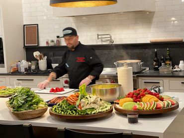 Chef Shawn Tibbitts preparing a private home meal through the Tibbitts @ Fern Hill private dining experience.