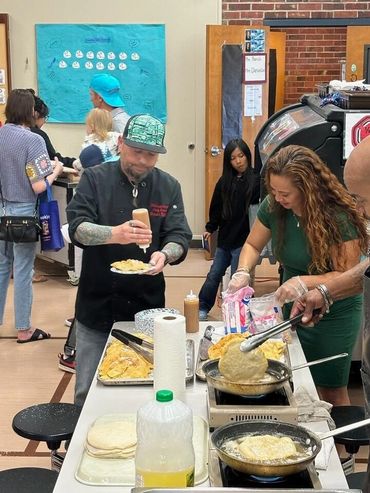 Chef Shawn hard at work preparing fresh ingredients for the community feed.