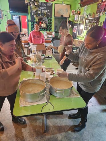 Working together to prep large batches of comforting, home-cooked food from scratch.
