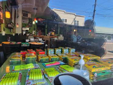 Brightly packaged school supplies and essentials lined up for local families.