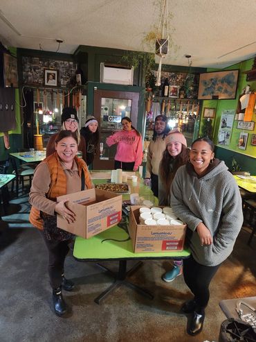 A wonderful group of volunteers helping pack up donation boxes for local families.