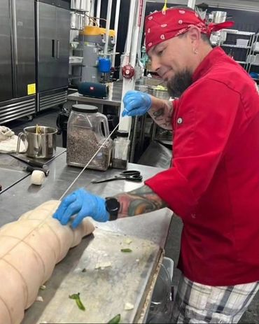 Chef Shawn Tibbitts collaborating with Chef Jan Parker for a community pop-up dining event.