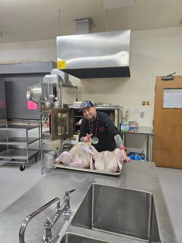 Chef Shawn hard at work in the kitchen preparing holiday meals for the community.